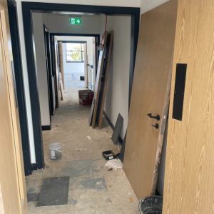 Fitting wooden doors in office building